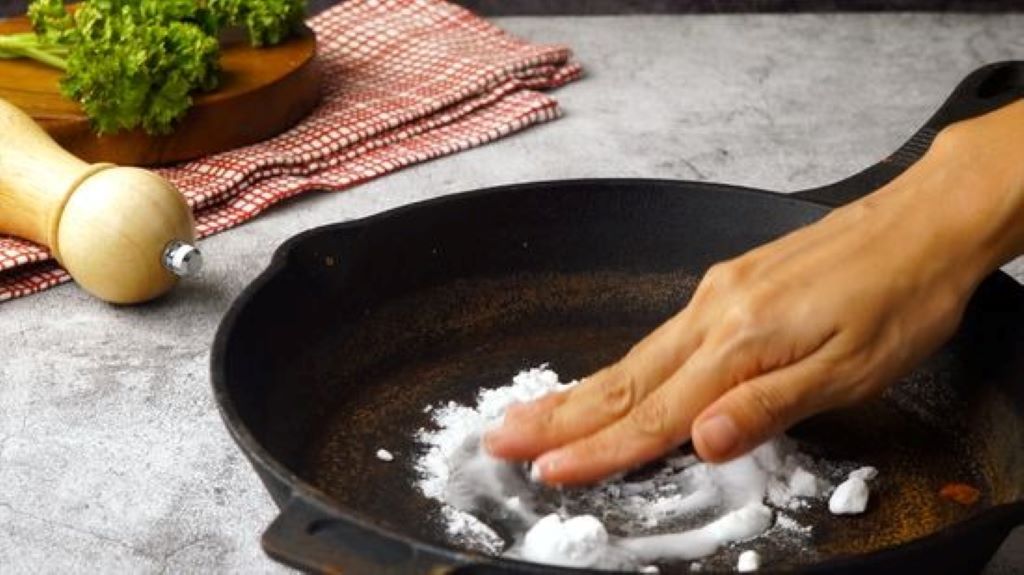 Step-by-step guide showing how to remove rust from a cast iron skillet and restore it to cooking condition