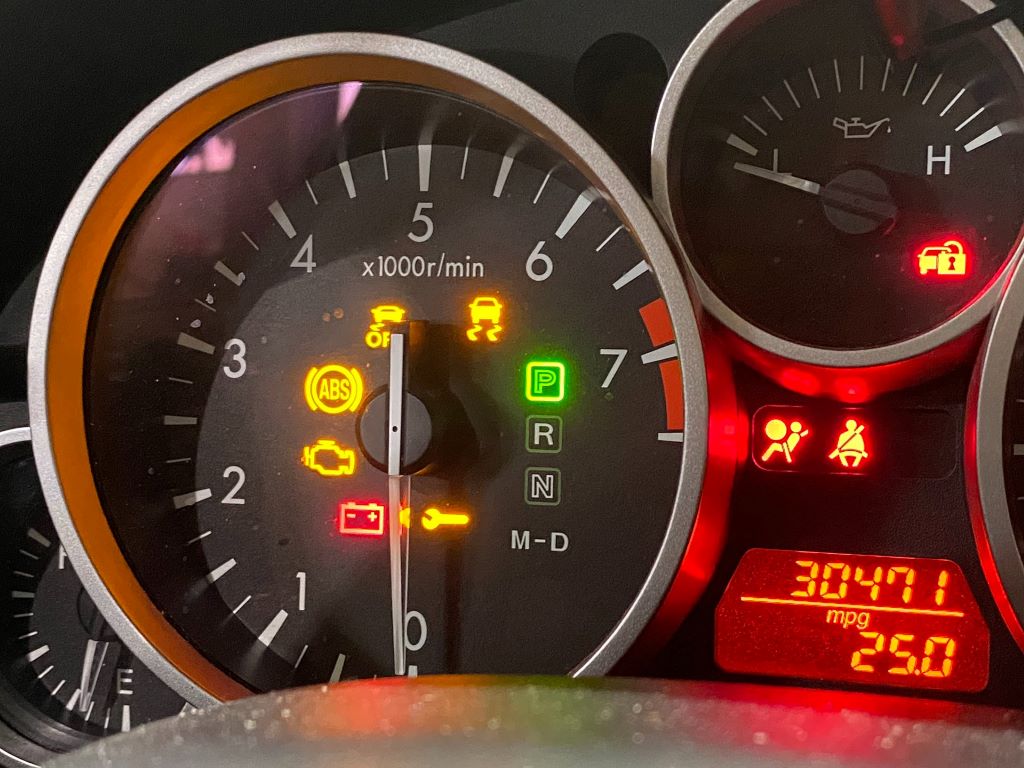 Car dashboard lights on but engine won’t start, illustrating troubleshooting steps for a no-start vehicle