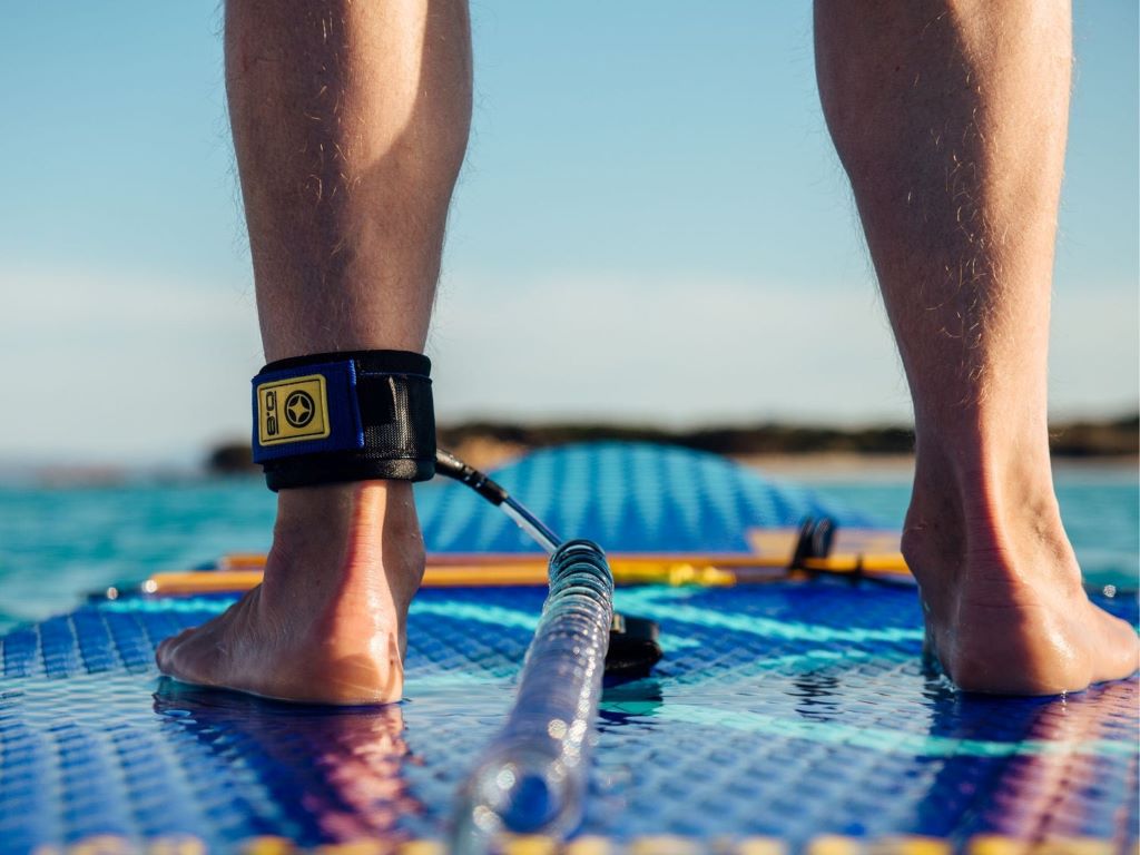 Inflatable paddle board packed in travel bag for summer trip