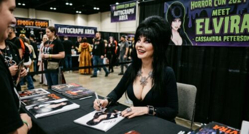 Elvira actress Cassandra Peterson signing autographs at a horror convention