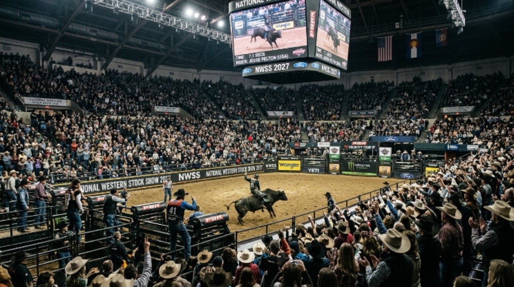 Crowds watching a professional bull riding competition at the National Western Stock Show 2027 in Denver